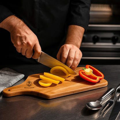 Acacia wood cutting board in use for slicing vegetables